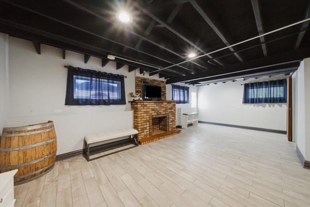Basement brick fireplace with TV